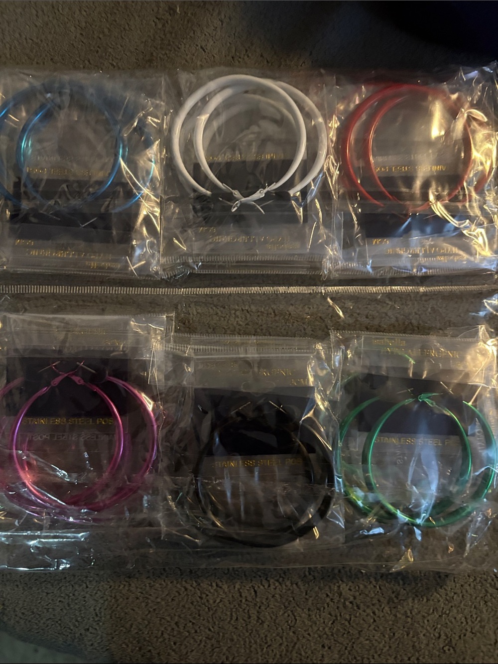 Fashion earrings..12 pk of multicolored hoops